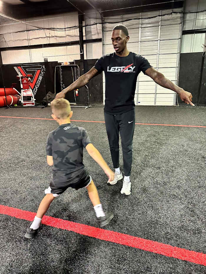 Christian Blake leading drills at Legacy Sports Complex.